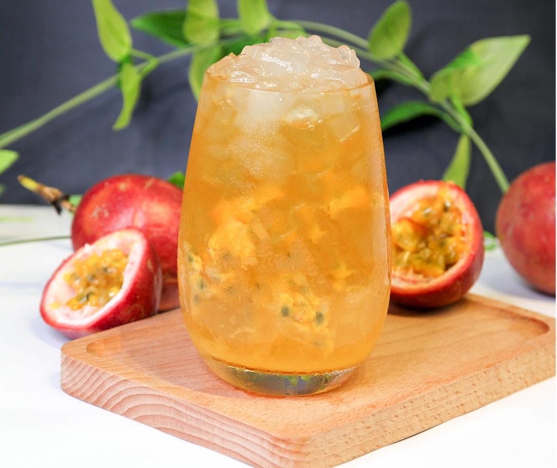 Tropical passion fruit aloe vera beverage with fresh passion fruit.